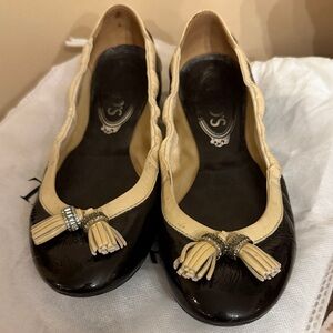 Tods Black and Cream Tassel Flats.